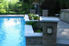The completed project updates an aging patio around a pool, breathing new life into this area.