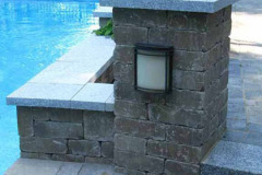 Use of granite is repeated in the steps and the cap on the planters and columns. The night lighting allows for more use long into the night.