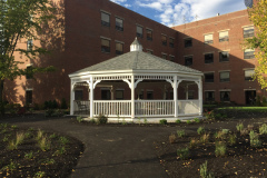 The gazebo creates a shady gathering place and a strong visual focal point at the center of the garden.