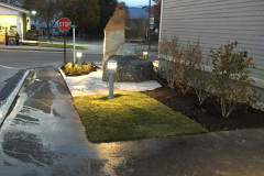 Grass sod is installed, and the accent lighting adds drama in the evening.