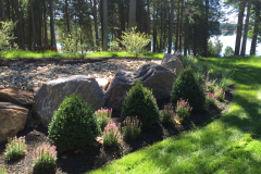 The basement walkout has a lovely focal bed.