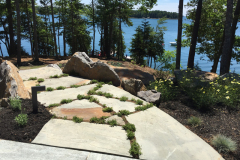 The walkway joints are planted and micro-irrigation tubes are installed between the slabs.