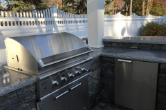 The built-in grill and mini fridge are installed.