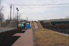 View up sidewalk to park entrance.